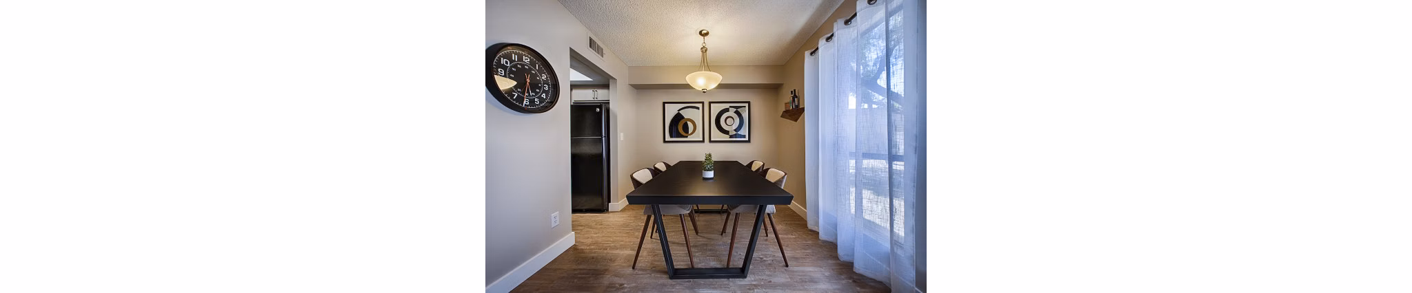Dining area with modern decor and stylish seating at Avana at the Pointe Apartments