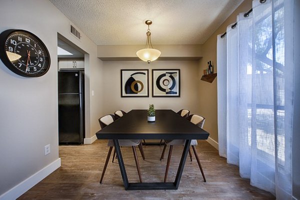 Dining area with modern decor and stylish seating at Avana at the Pointe Apartments
