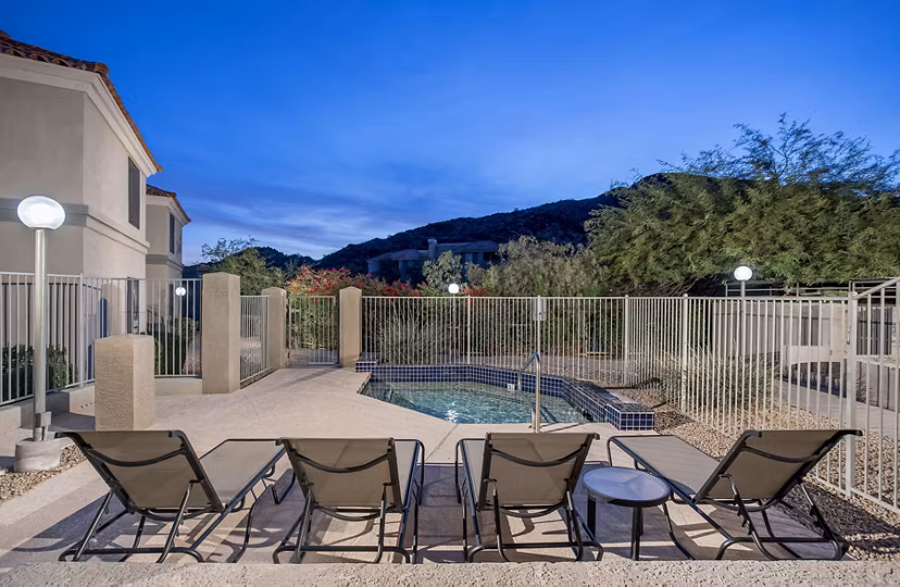 Resort-style pool with vibrant landscaping at Avana at the Pointe Apartments, enhancing luxury outdoor living experience