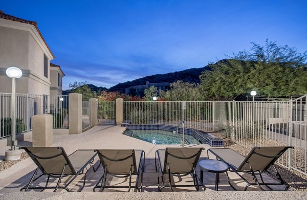 Resort-style pool with vibrant landscaping at Avana at the Pointe Apartments, enhancing luxury outdoor living experience