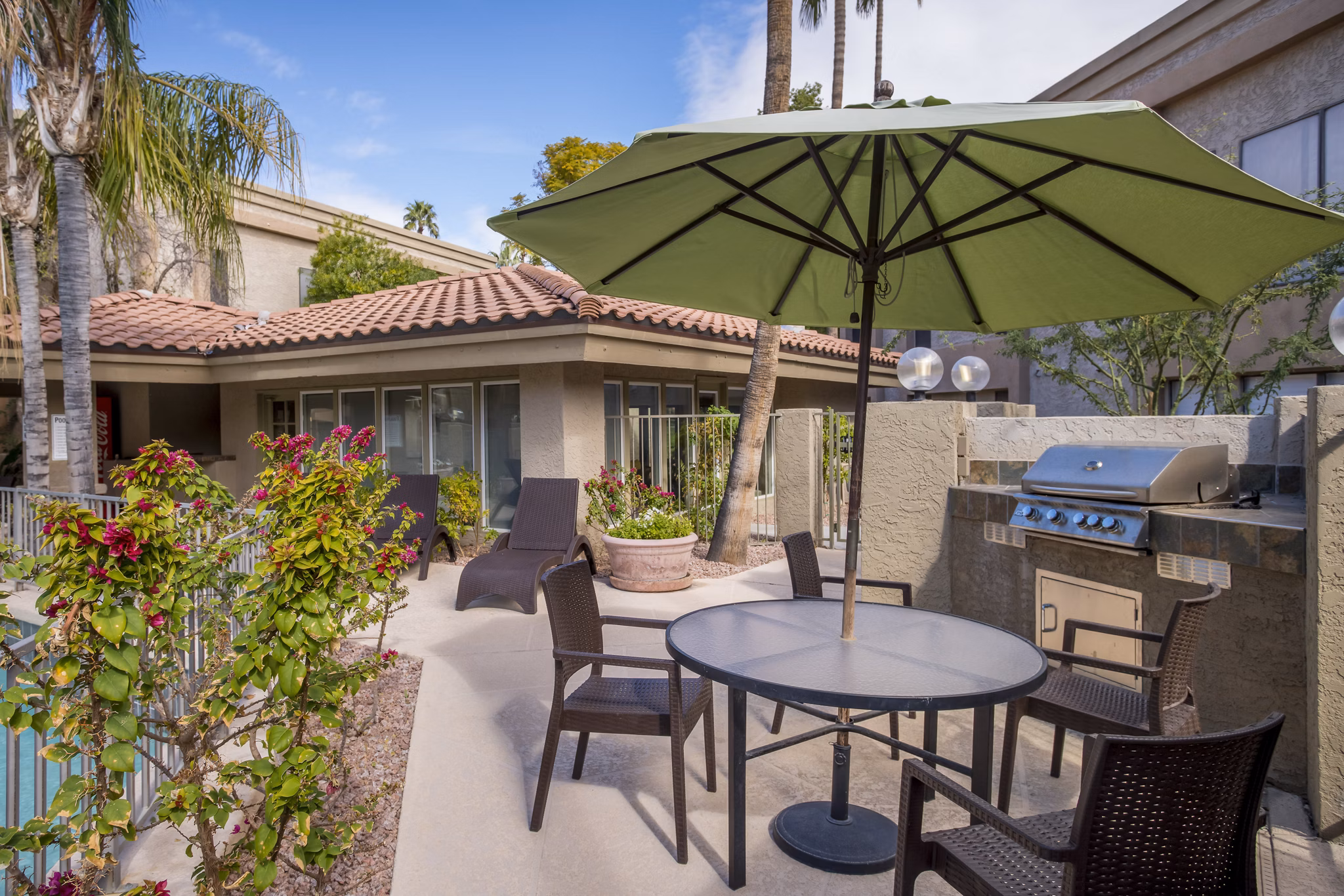 Outdoor grill area with modern seating at Avana at the Pointe Apartments, perfect for social gatherings and BBQs