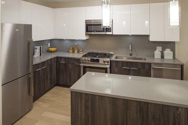 Elegant dining room with modern decor and large windows at Atlantic Station Apartments