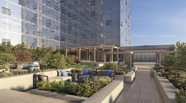 Rooftop patio with modern seating and skyline views at Atlantic Station Apartments