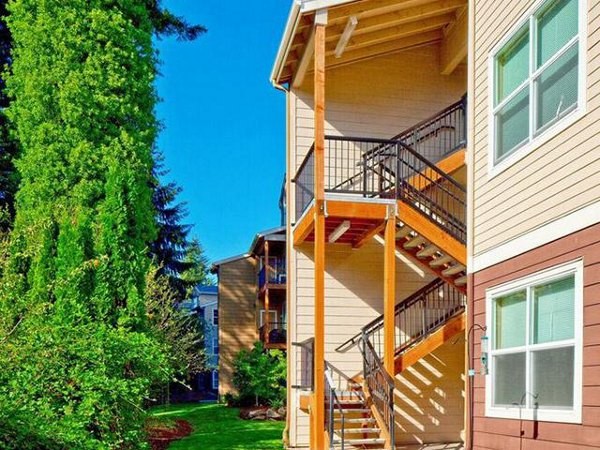 Jory Trail Apartments: Elegant view of luxury apartments at sunset in Wilsonville