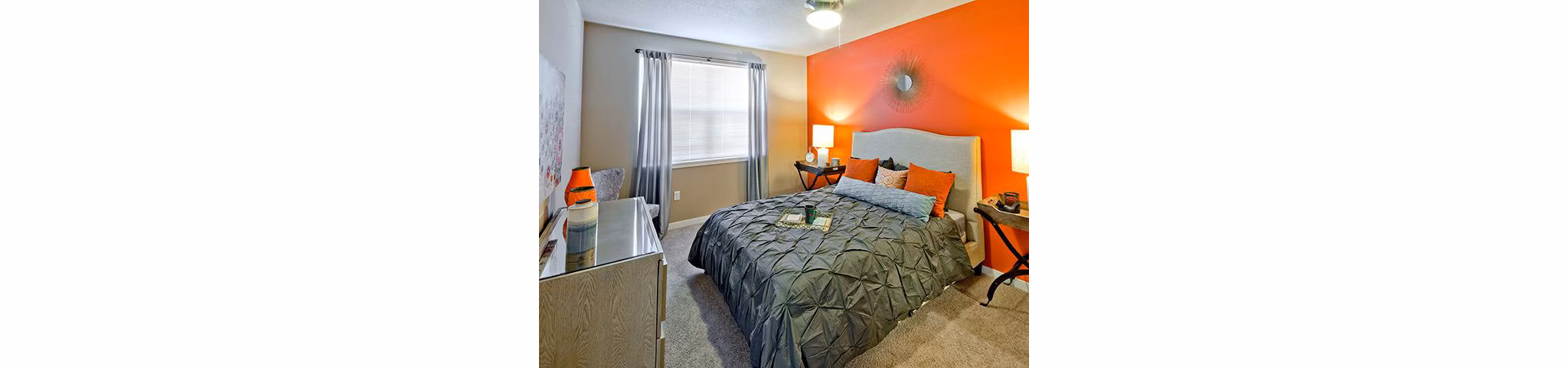 Cozy bedroom with stylish furnishings at Jory Trail Apartments