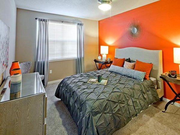 Cozy bedroom with stylish furnishings at Jory Trail Apartments