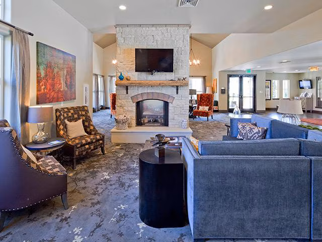 Clubhouse with modern design at Jory Trail Apartments featuring luxury seating and decor