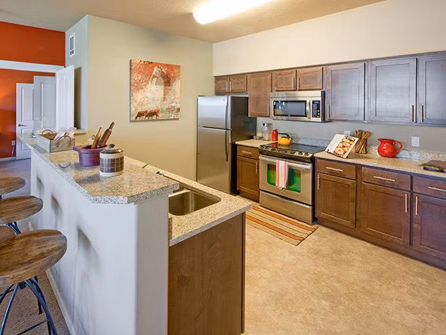 Modern kitchen with stainless steel appliances at Jory Trail Apartments
