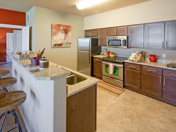 Modern kitchen with stainless steel appliances at Jory Trail Apartments