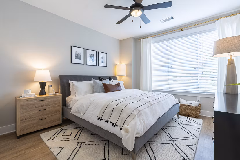 Cozy bedroom with elegant furnishings at The Sawyer Providence Farm Apartments