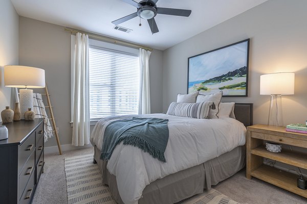 Cozy bedroom with modern decor at The Sawyer Providence Farm Apartments