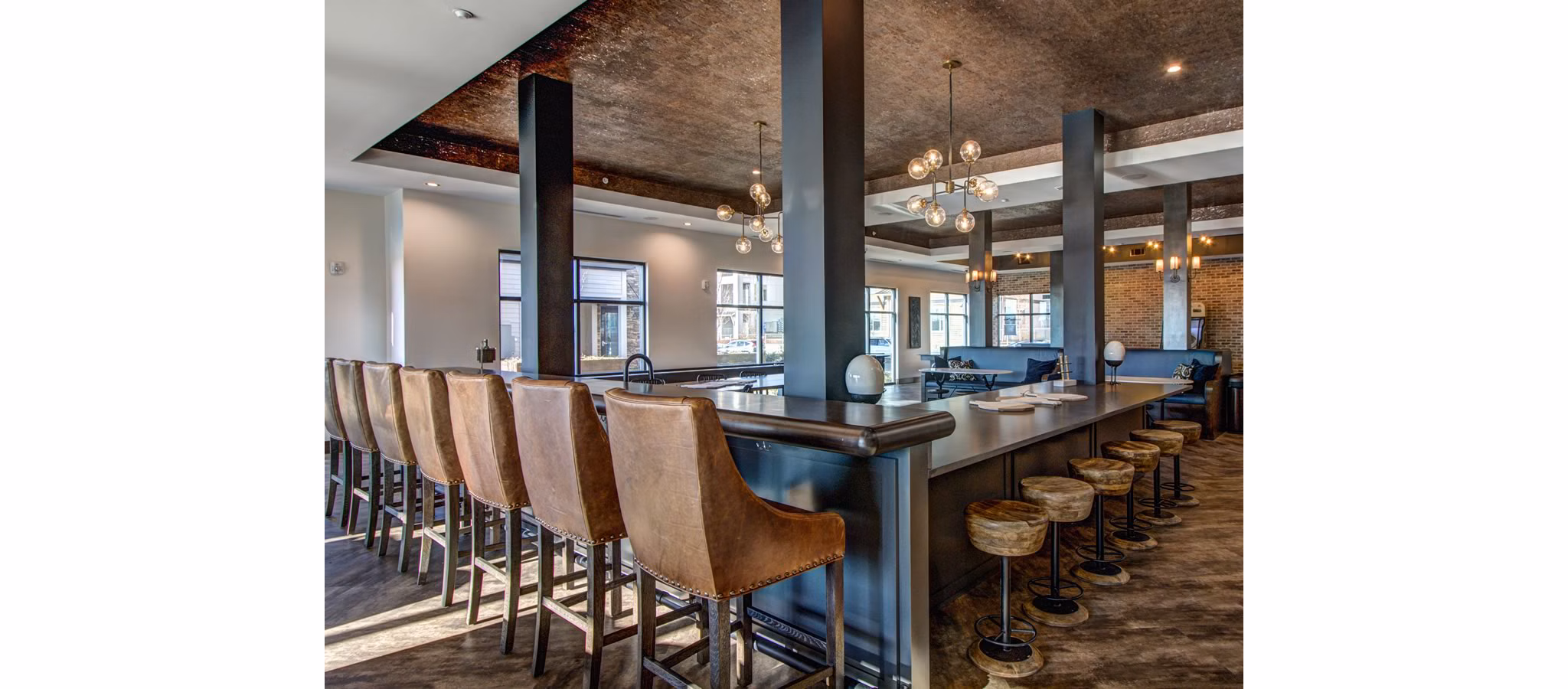 Clubhouse at The Sawyer Providence Farm Apartments: Elegant community gathering space with modern decor and ample seating for residents