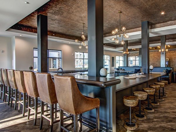 Clubhouse at The Sawyer Providence Farm Apartments: Elegant community gathering space with modern decor and ample seating for residents