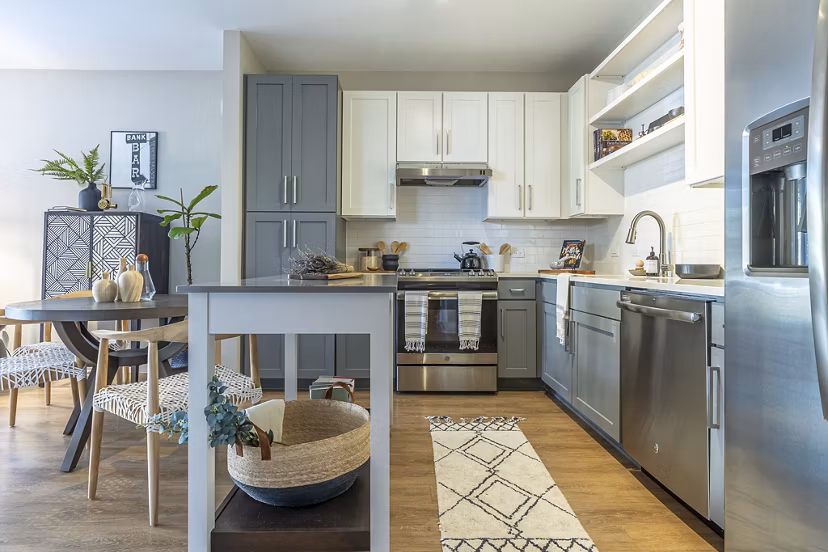 Modern kitchen with stainless steel appliances at The Sawyer Providence Farm Apartments, ideal for luxury living in a Greystar community