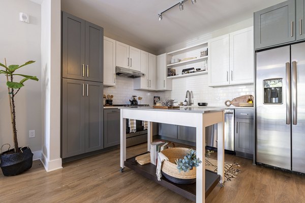 Modern kitchen featuring stainless steel appliances at The Sawyer Providence Farm Apartments