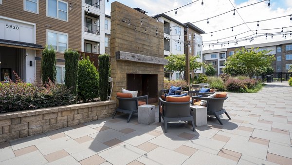 Cozy outdoor fire pit area at The Sawyer Providence Farm Apartments