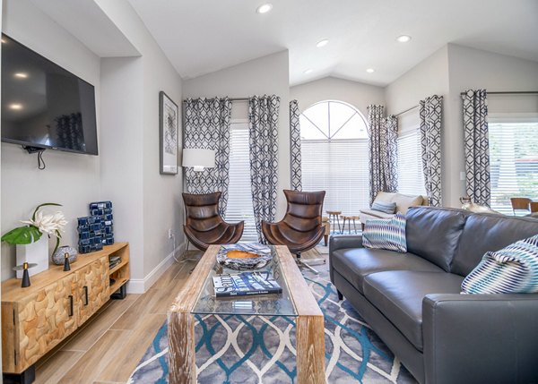 Inviting clubhouse featuring modern seating and entertainment options at Green Tree Place Apartments