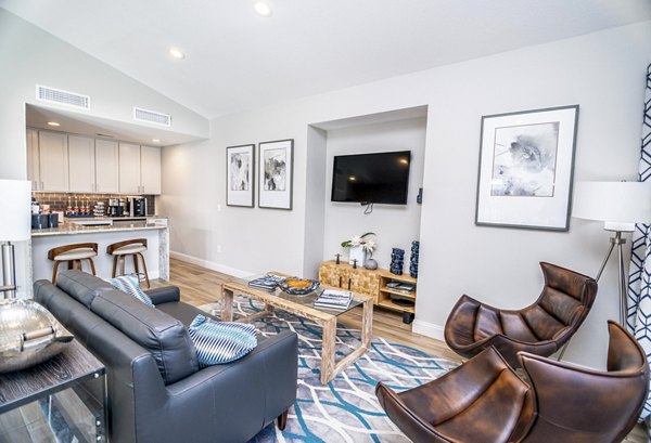 Clubhouse featuring modern decor and seating at Green Tree Place Apartments, perfect for social gatherings and relaxation