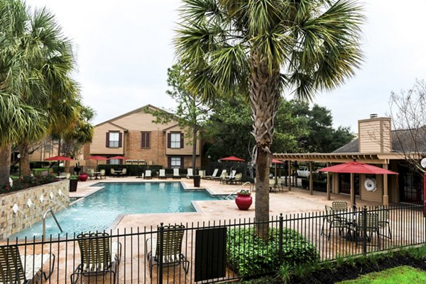 Luxurious swimming pool at Westborough Crossing Apartments, featuring elegant lounge area and vibrant landscaping