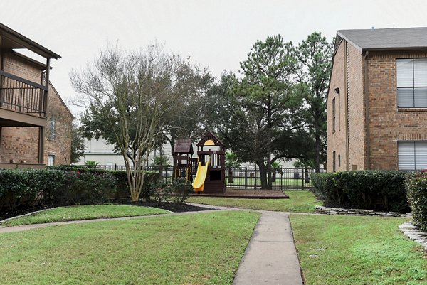 Children's playground with slides and climbing equipment at Westborough Crossing Apartments