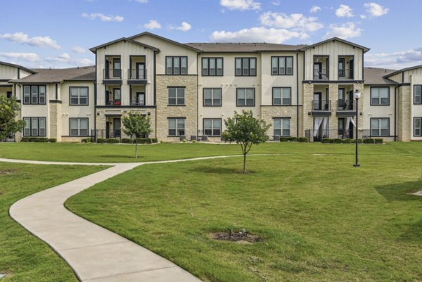 building at Enclave Falcon Pointe Apartments