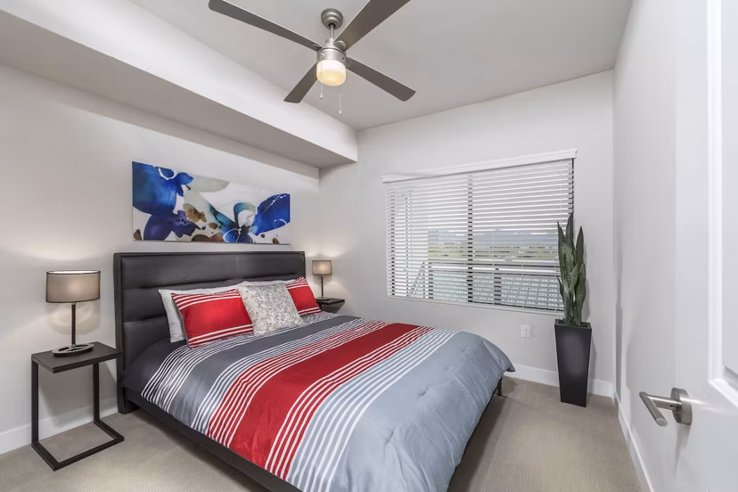 Cozy bedroom with elegant decor in Overture Kierland, luxury apartments by Greystar