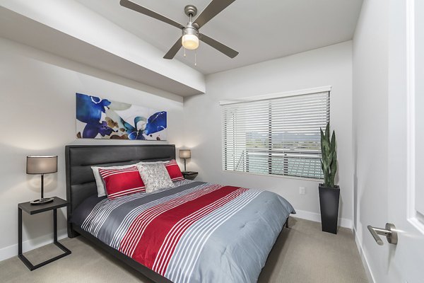 Cozy bedroom with elegant decor in Overture Kierland, luxury apartments by Greystar