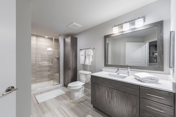 Luxurious bathroom with marble countertops at Overture Kierland