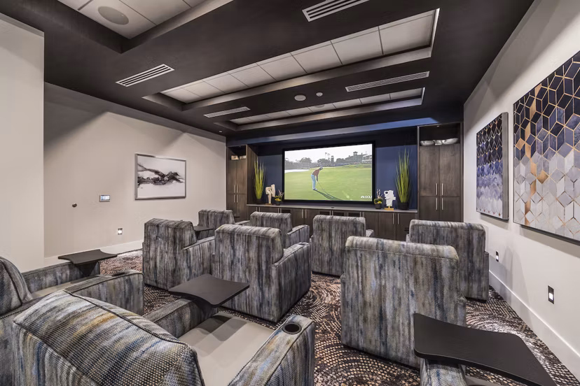 Theater room with plush seating and large screen at Overture Kierland, a Greystar luxury apartment community in Scottsdale, Arizona