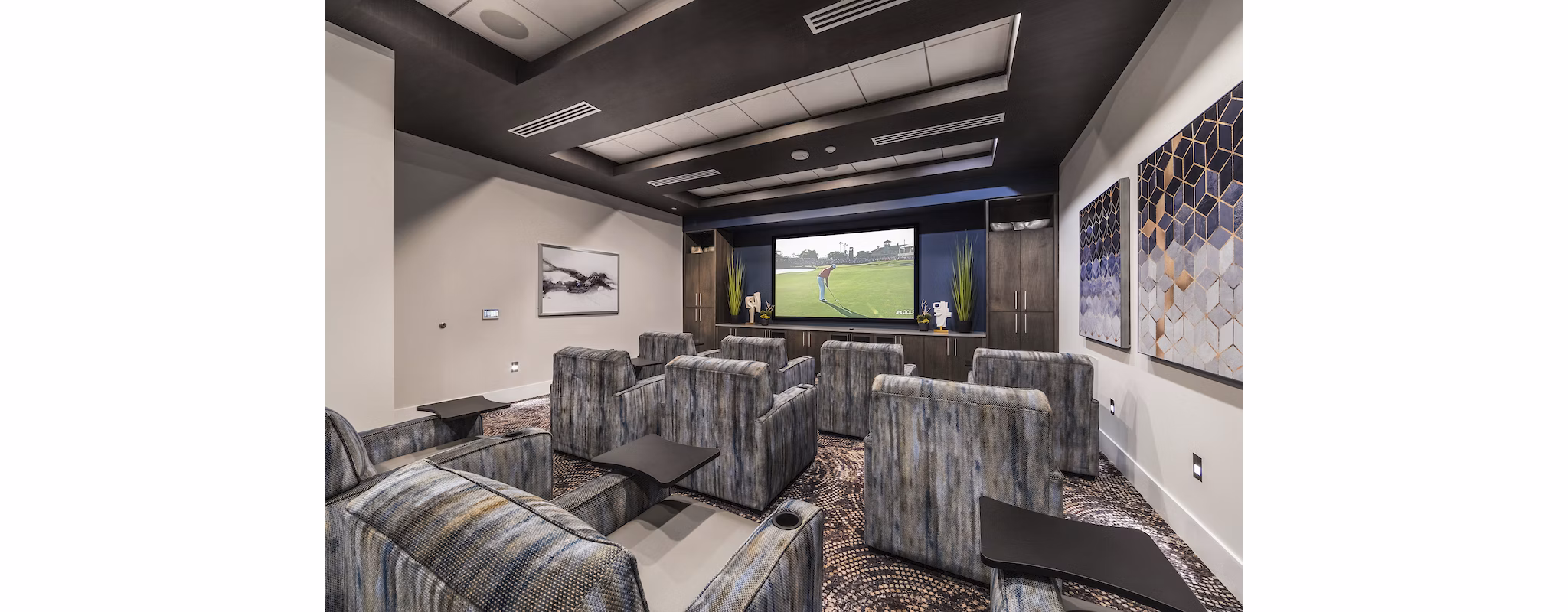 Theater room with plush seating and large screen at Overture Kierland, a Greystar luxury apartment community in Scottsdale, Arizona