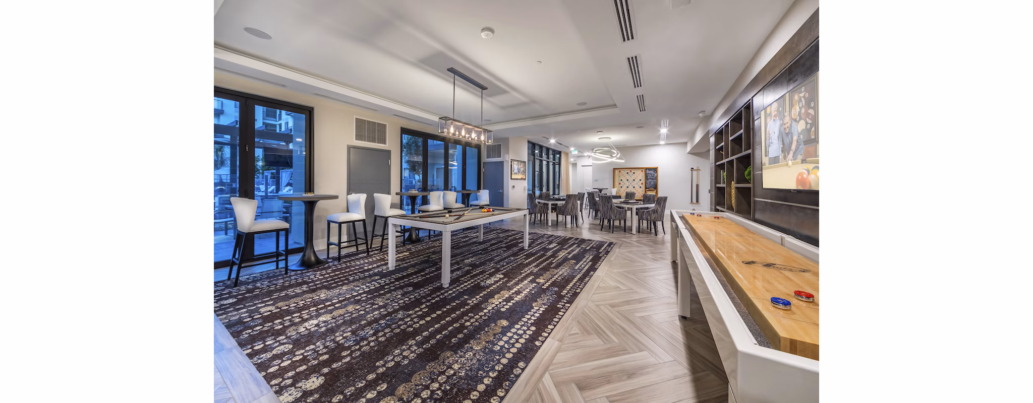 Game room with pool table and lounge seating at Overture Kierland luxury apartments