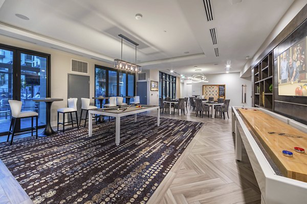 Game room with pool table and lounge seating at Overture Kierland luxury apartments