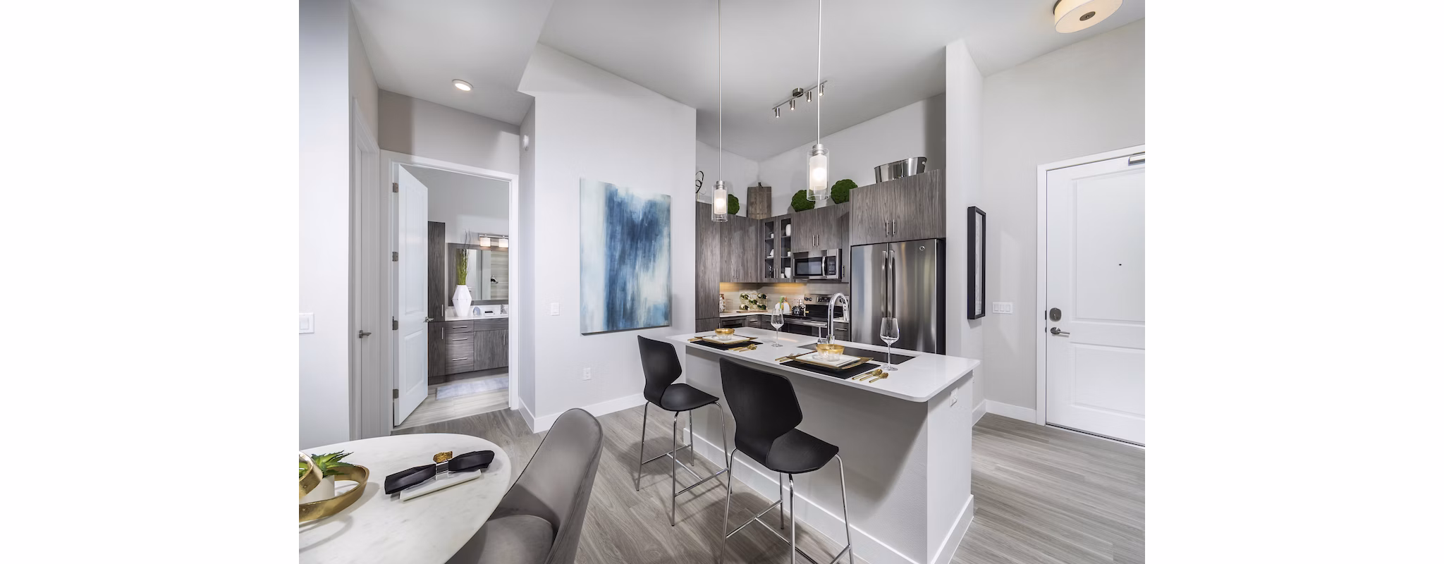 Modern kitchen with stainless steel appliances and granite countertops at Overture Kierland apartments