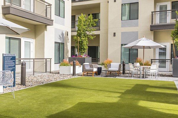 Well-designed recreational area at Overture Kierland featuring modern seating and lush greenery