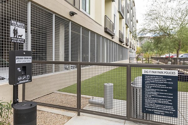 Community dog park at Overture Kierland offering shaded seating and agility equipment, ideal for pet-friendly luxury apartment living