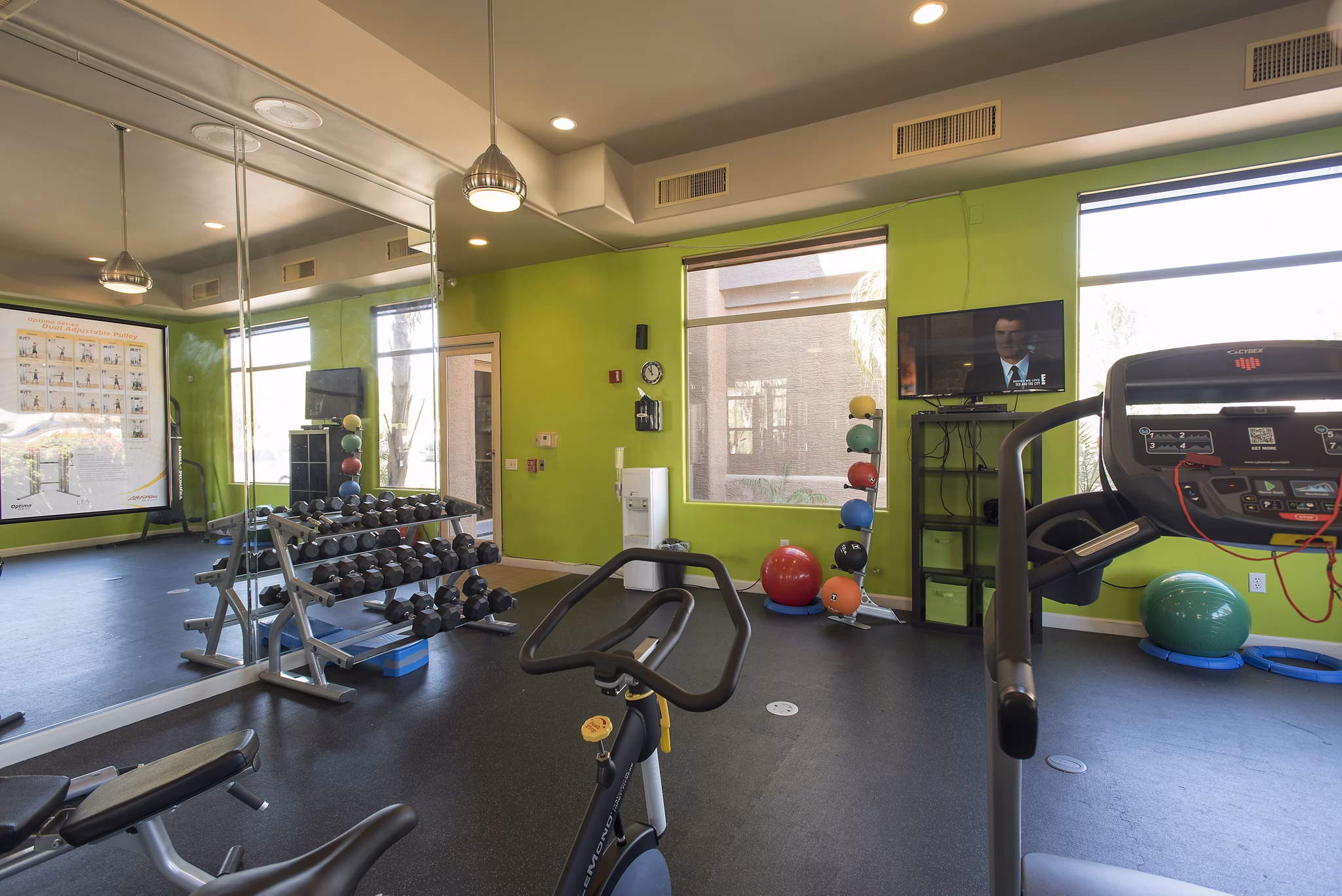 Modern fitness center with state-of-the-art equipment at Santa Rosa Apartments, perfect for active lifestyles in a luxury setting