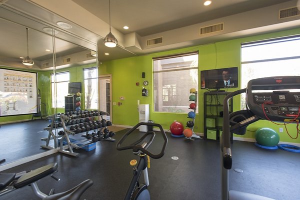 Modern fitness center with state-of-the-art equipment at Santa Rosa Apartments, perfect for active lifestyles in a luxury setting