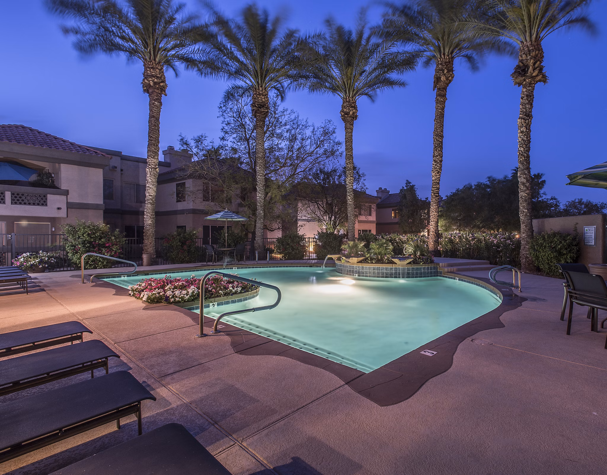 Inviting pool area with lounge chairs at Santa Rosa Apartments, offering luxury living experiences
