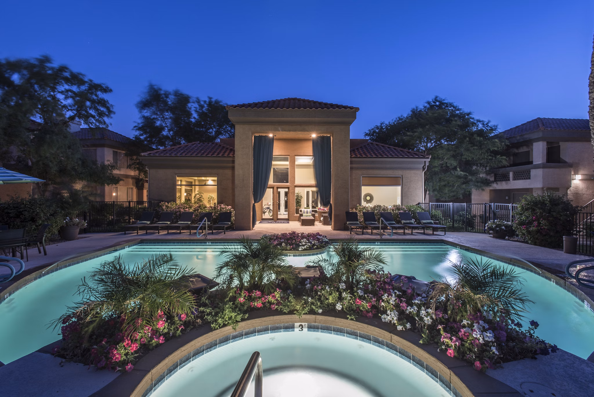 Relaxing poolside retreat at Santa Rosa Apartments, offering luxury amenities and serene surroundings in a premium community setting