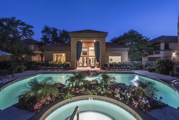 Relaxing poolside retreat at Santa Rosa Apartments, offering luxury amenities and serene surroundings in a premium community setting