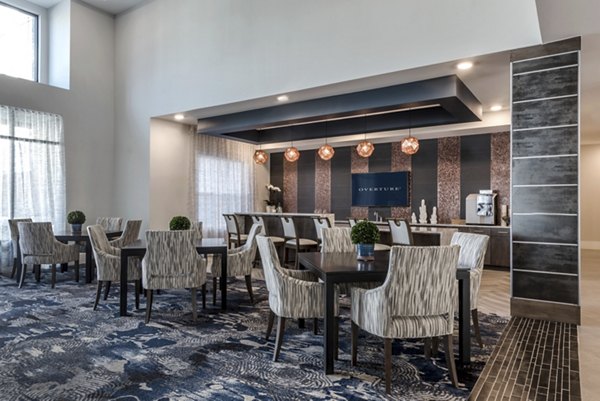 Overture Cotswold: Modern luxury apartment with lush landscaping in a vibrant Charlotte neighborhood
