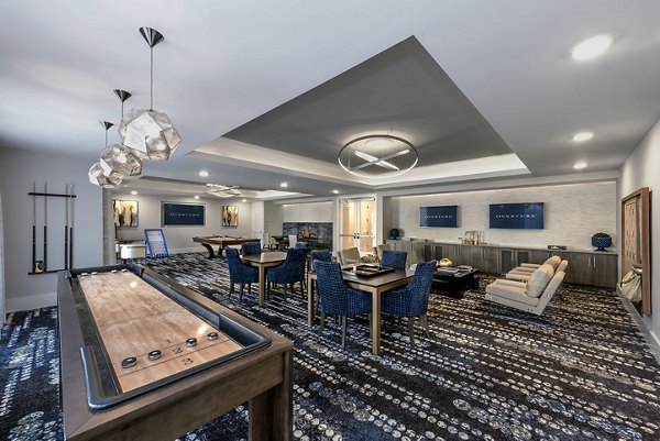 Game room with billiards table and lounge seating at Overture Cotswold luxury apartments