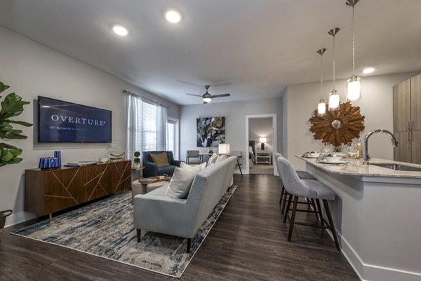 Modern living room and kitchen with stylish decor and an inviting layout in luxury apartments