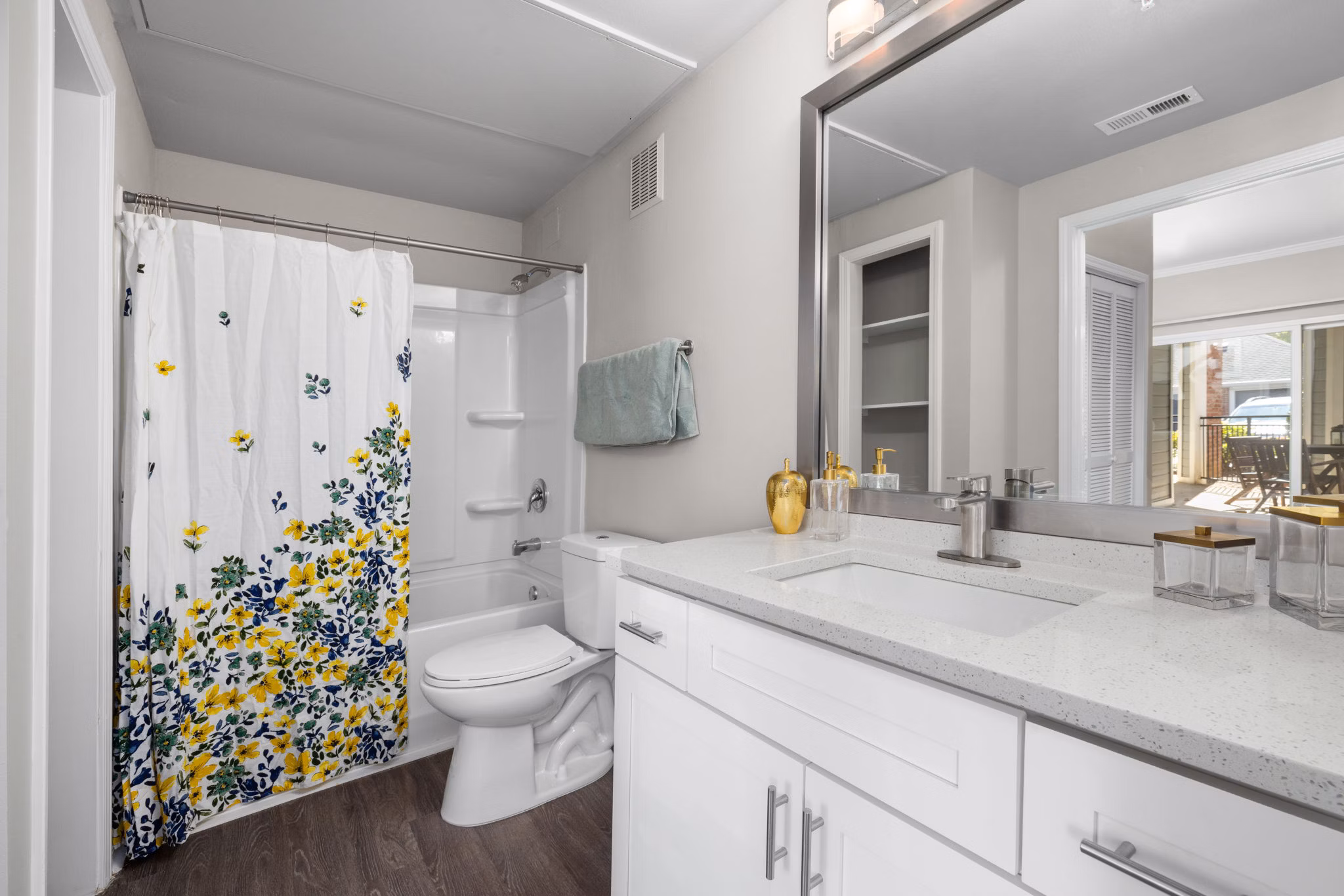 Luxurious bathroom with modern fixtures at Cary Greens at Preston Apartments, highlighting elegance in every detail