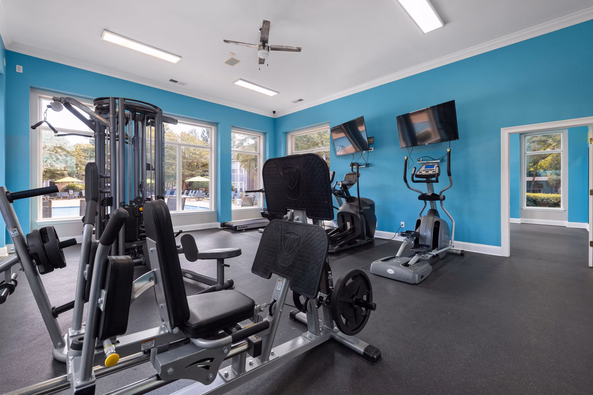 Spacious fitness center with modern equipment at Cary Greens at Preston Apartments, perfect for workouts and exercise routines