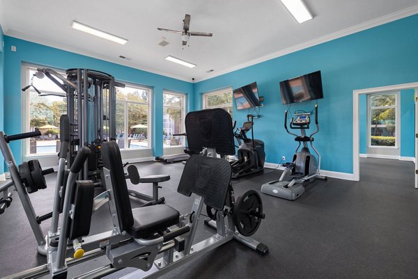Spacious fitness center with modern equipment at Cary Greens at Preston Apartments, perfect for workouts and exercise routines
