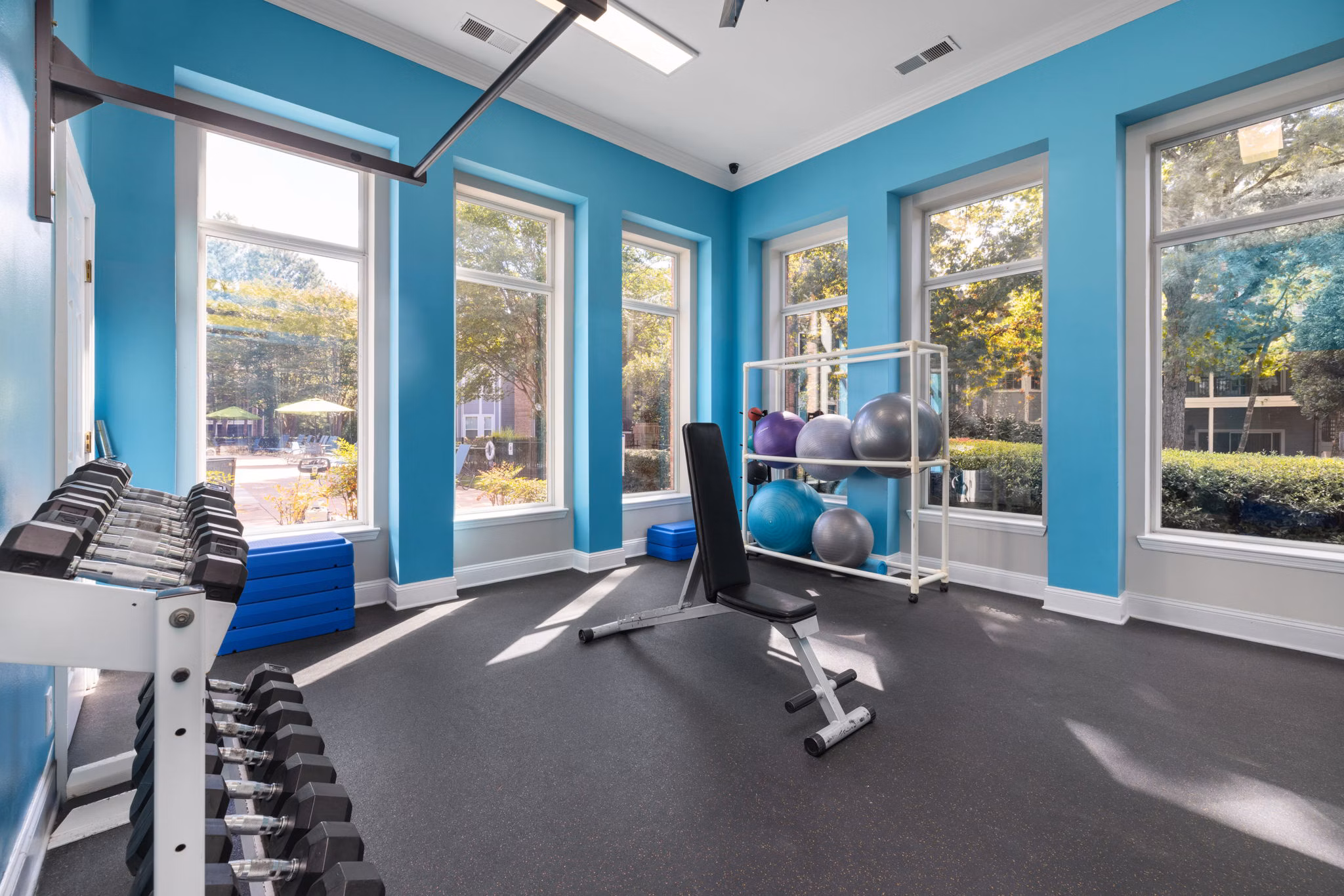 State-of-the-art fitness center with modern equipment at Cary Greens at Preston Apartments