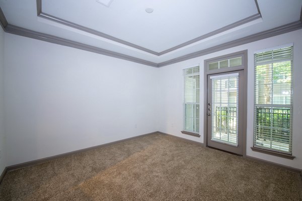 Comfortable bedroom with modern furnishings at Avana City North Apartments