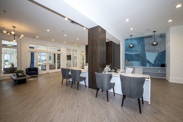 Modern clubhouse featuring fitness center at Avana City North Apartments