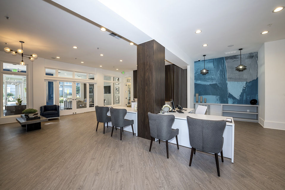 Modern clubhouse featuring fitness center at Avana City North Apartments